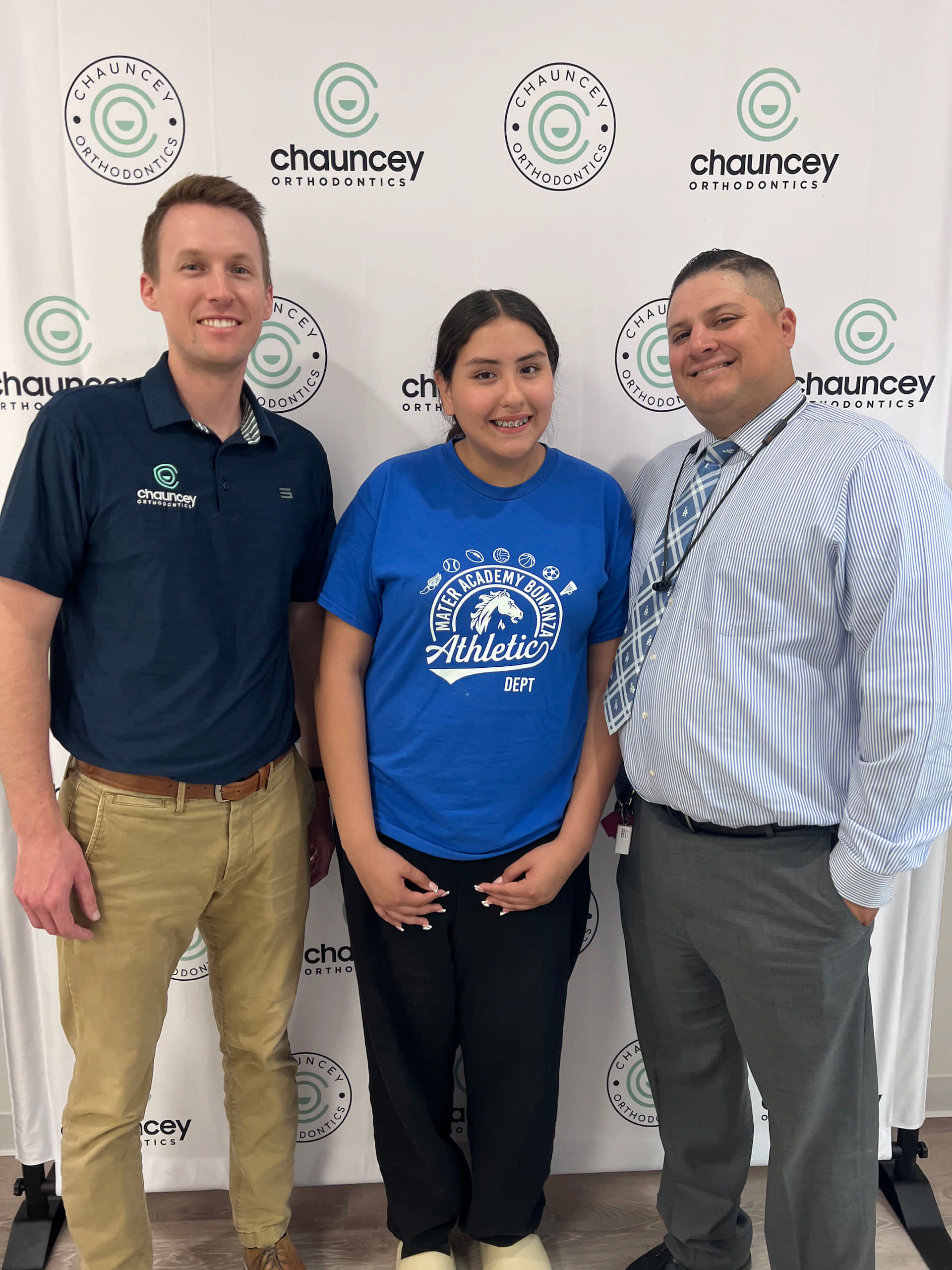 Dr Chauncey and his patient stand smiling in front of a Chauncey Orthodontics after undergoing braces treatment in Henderson NV.